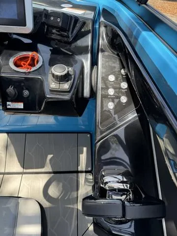 Slide: The Image of Control panel of 2022 Yamaha Boats 255XD, featuring sleek design and modern controls. - 22