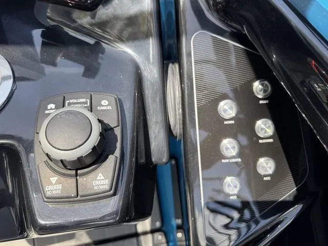 Slide: The Image of Control panel of 2022 Yamaha Boats 255XD, featuring cruise and volume controls. - 23