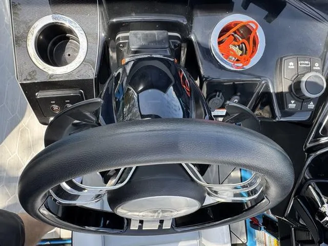 Slide: The Image of Steering wheel and controls of 2022 Yamaha Boats 255XD, featuring sleek design and modern technology. - 25