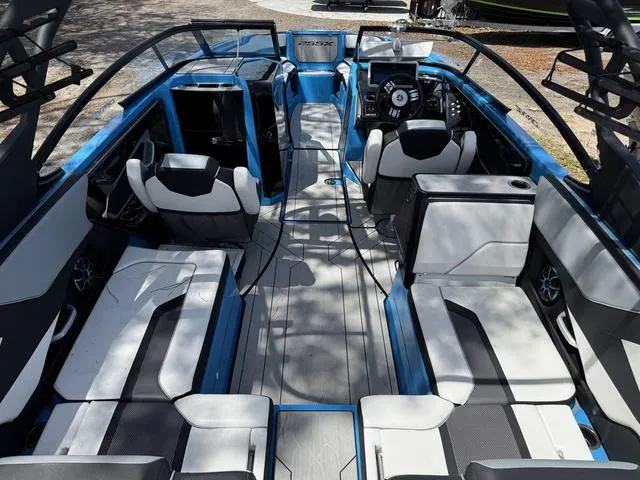 Slide: The Image of 2022 Yamaha Boats 255XD interior, featuring sleek seating and modern design elements. - 4