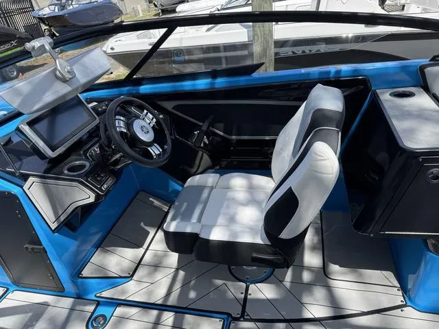 Slide: The Image of 2022 Yamaha Boats 255XD cockpit with modern controls and comfortable seating. - 7