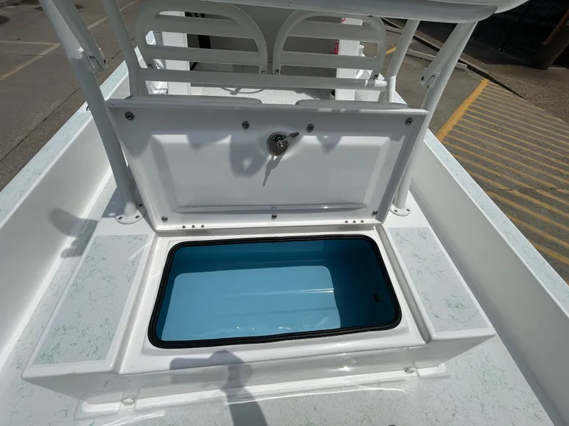 Slide: The Image of 2023 Shallow Sport 21 Sport boat with open storage compartment on deck. - 9