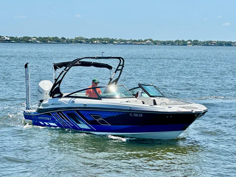 Slide: The Image of 2019 Monterey M45 boat cruising on a sunny day in open water. - 0