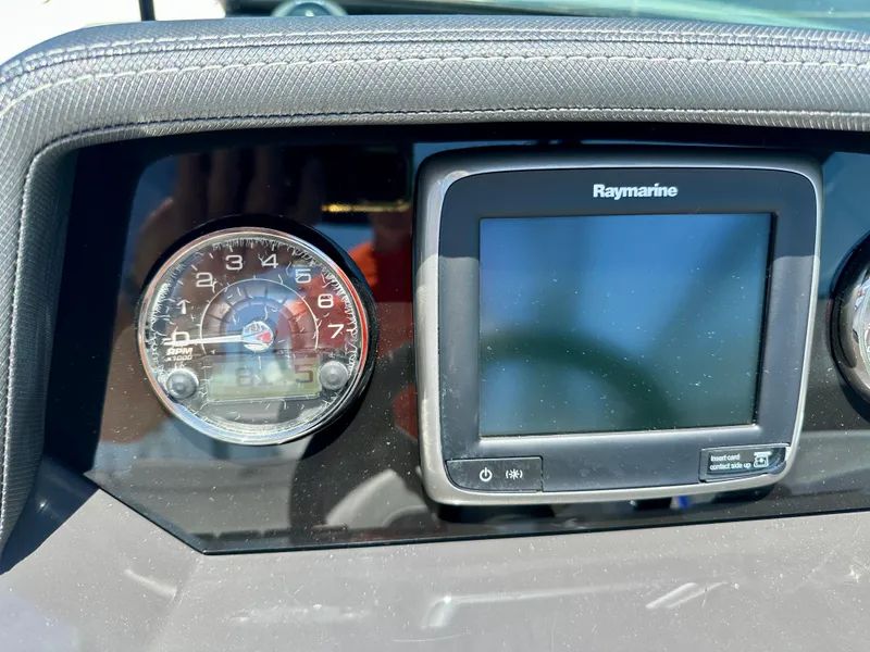 Slide: The Image of Dashboard of a 2019 Monterey M45 boat with Raymarine display and gauge. - 19
