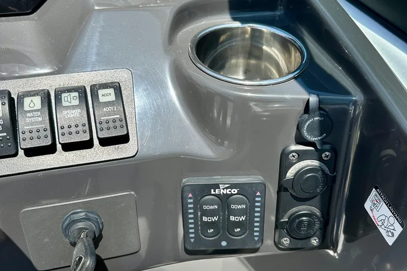 Slide: The Image of Control panel of a 2019 Monterey M45 boat with cup holder and switches. - 20