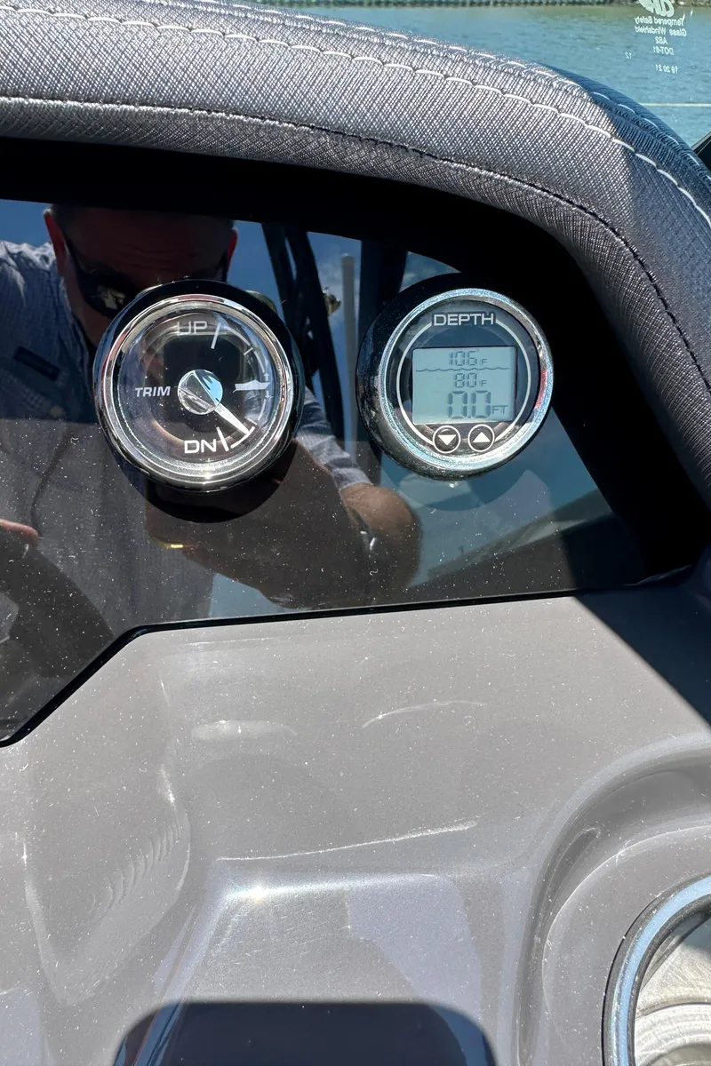 Slide: The Image of Dashboard of a 2019 Monterey M45 boat with depth and trim gauges. - 21