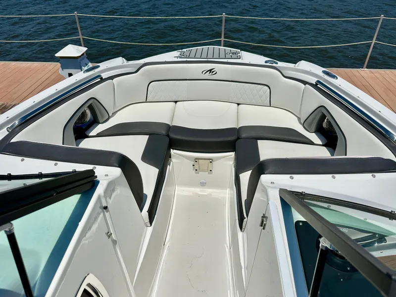 Slide: The Image of 2019 Monterey M45 boat with spacious seating, docked by the water. - 26