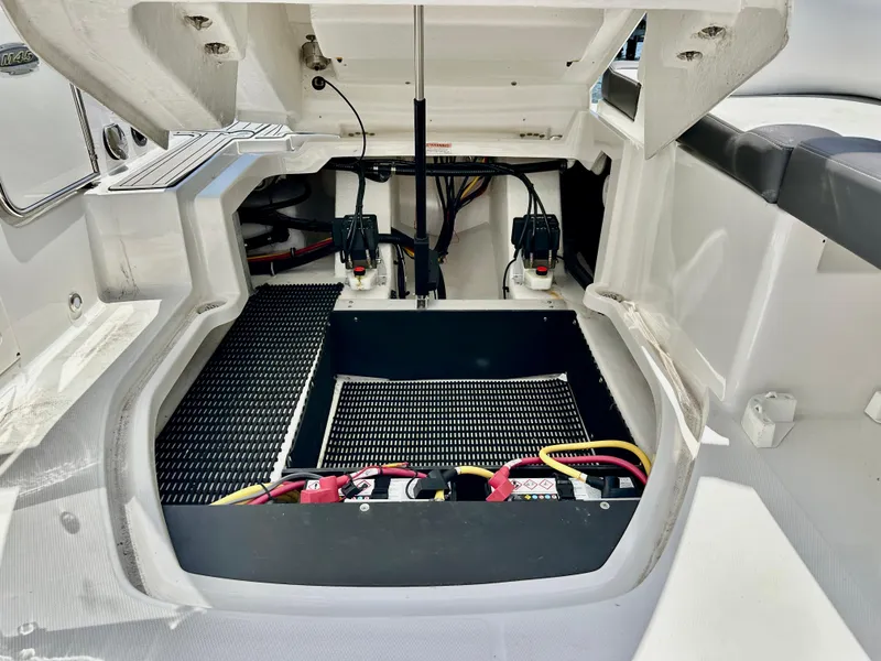Slide: The Image of Open engine compartment of 2019 Monterey M45 boat, showcasing battery setup and wiring. - 29