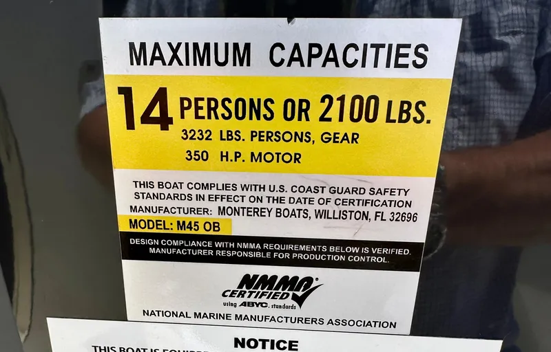 Slide: The Image of Maximum capacity sign for 2019 Monterey M45 boat: 14 persons or 2100 lbs. - 30