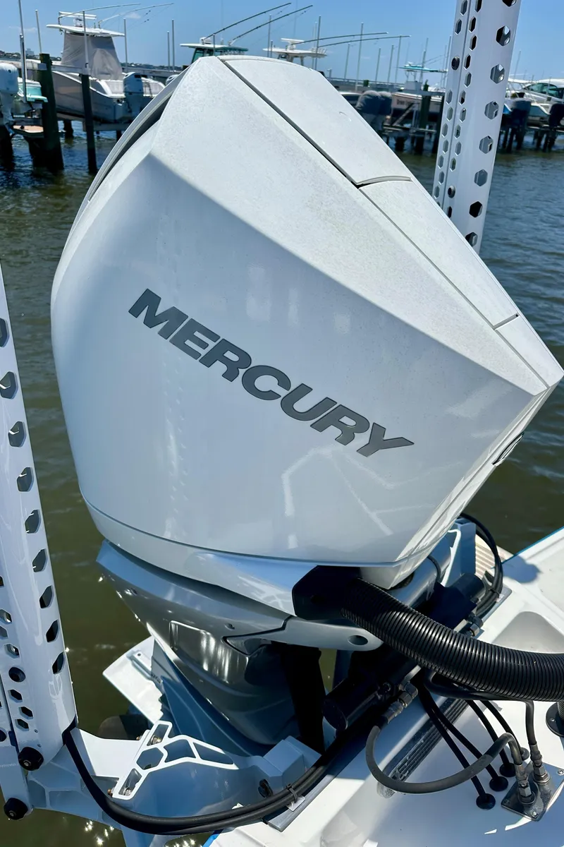 Slide: The Image of Mercury outboard motor on a 2019 Monterey M45 boat at a marina. - 9