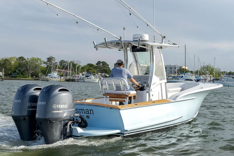 Slide: The Image of 2003 Shearline 23 Center Console boat with dual Yamaha engines on the water. - 2