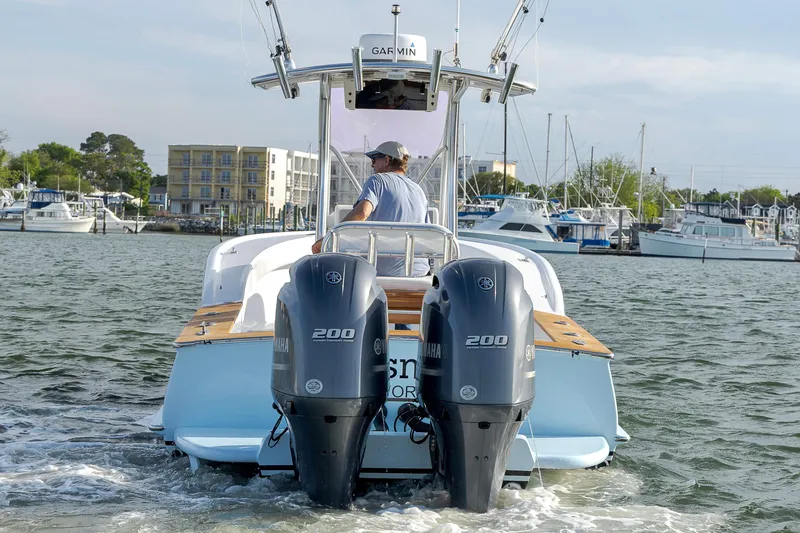 Slide: The Image of 2003 Shearline 23 Center Console boat with dual Yamaha 200 engines on the water. - 5