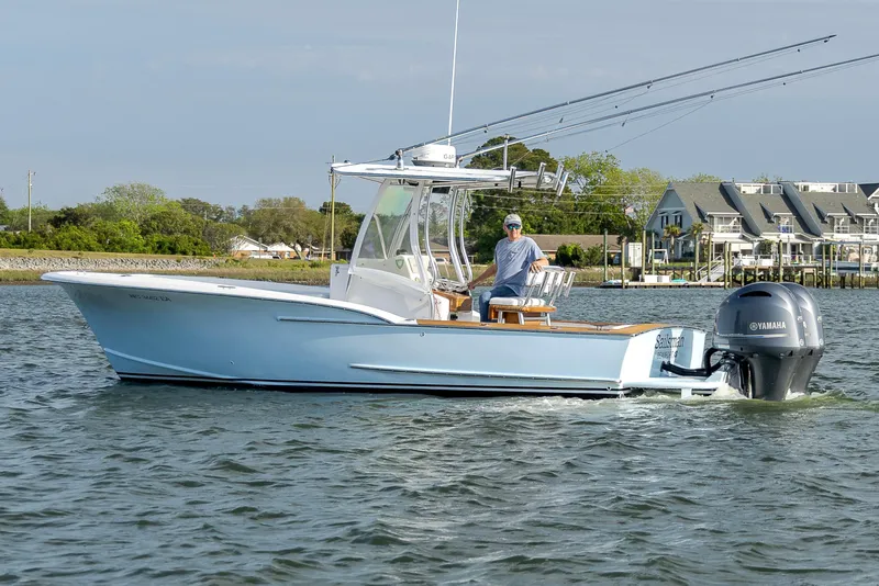 Slide: The Image of 2003 Shearline 23 Center Console boat on water, with Yamaha outboard motor. - 9