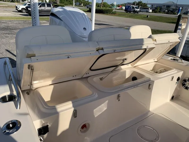 Slide: The Image of 2023 Grady-White 251 Coastal Explorer boat with open storage compartments and seating. - 11