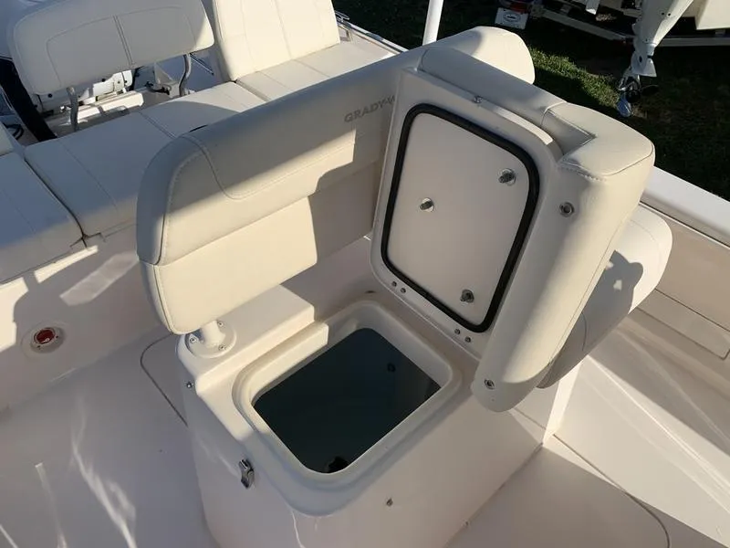 Slide: The Image of 2023 Grady-White 251 Coastal Explorer boat seat with storage compartment open. - 19