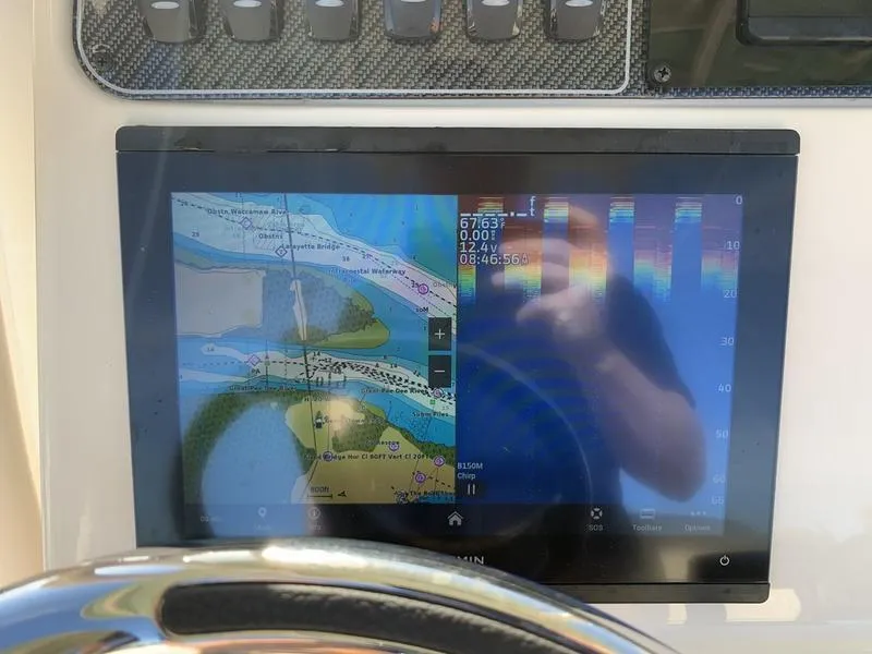 Slide: The Image of Close-up of a 2023 Grady-White 251 Coastal Explorer's navigation display screen. - 21