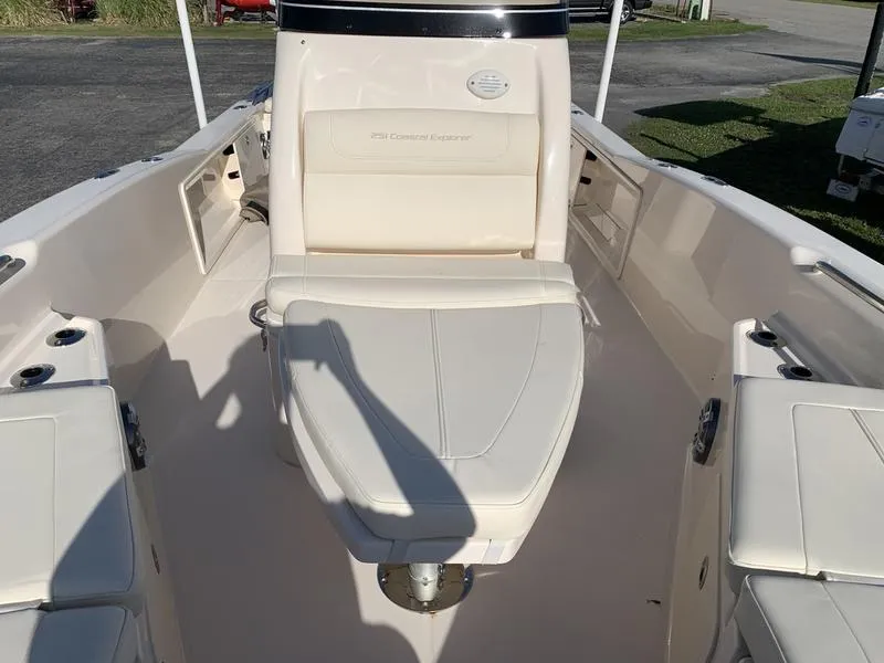 Slide: The Image of 2023 Grady-White 251 Coastal Explorer boat interior with seating and storage compartments. - 29