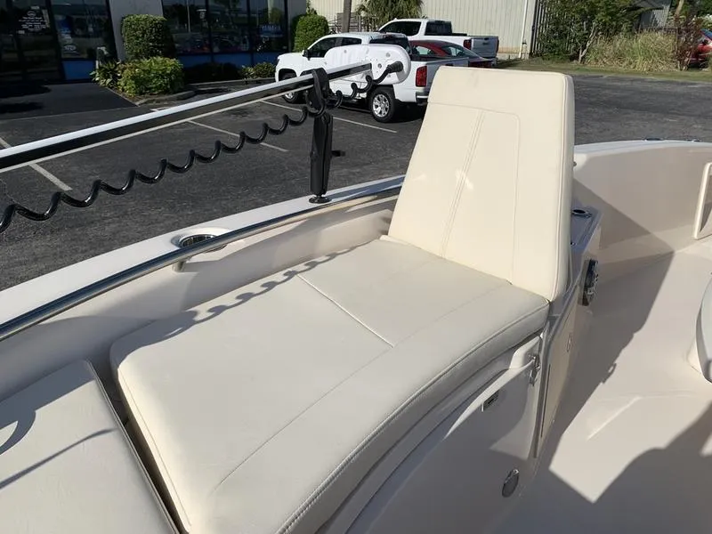 Slide: The Image of 2023 Grady-White 251 Coastal Explorer boat with beige seating in a parking lot. - 31