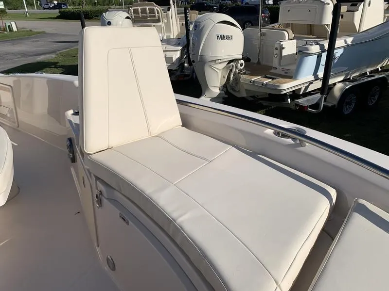 Slide: The Image of 2023 Grady-White 251 Coastal Explorer boat with Yamaha engine, featuring a comfortable white seat. - 32