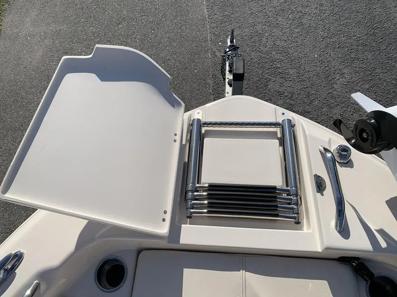 Slide: The Image of 2023 Grady-White 251 Coastal Explorer boat with folded ladder and storage compartment. - 34