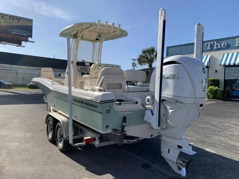 Slide: The Image of 2023 Grady-White 251 Coastal Explorer boat on trailer, featuring Yamaha outboard motor. - 4