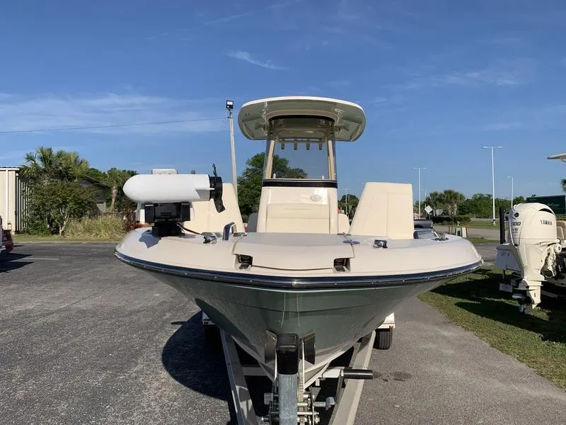 Slide: The Image of 2023 Grady-White 251 Coastal Explorer boat on trailer, parked outdoors under clear sky. - 7