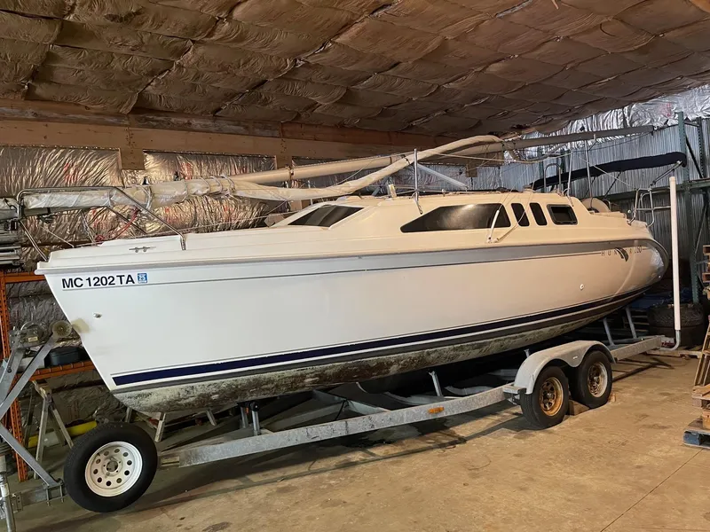 Slide: The Image of 2002 Hunter 260 sailboat on trailer in indoor storage. - 33