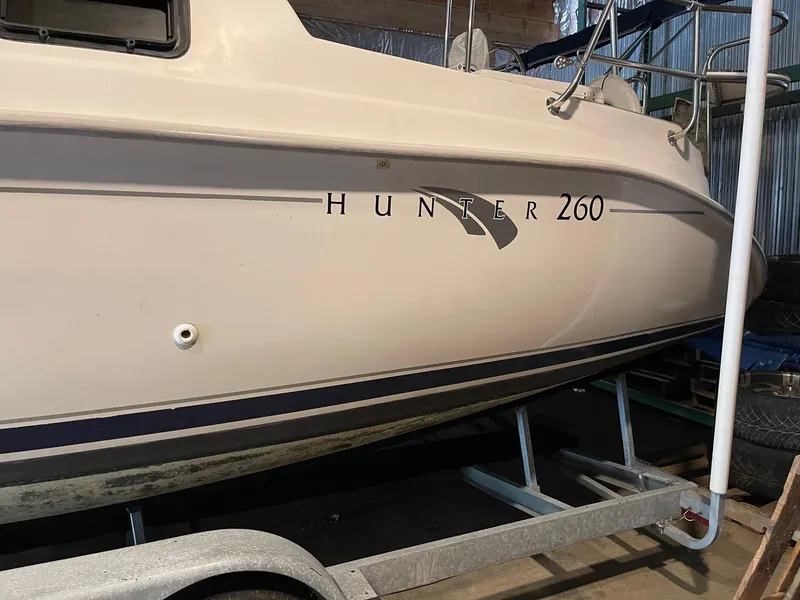 Slide: The Image of 2002 Hunter 260 sailboat on trailer in storage. - 34