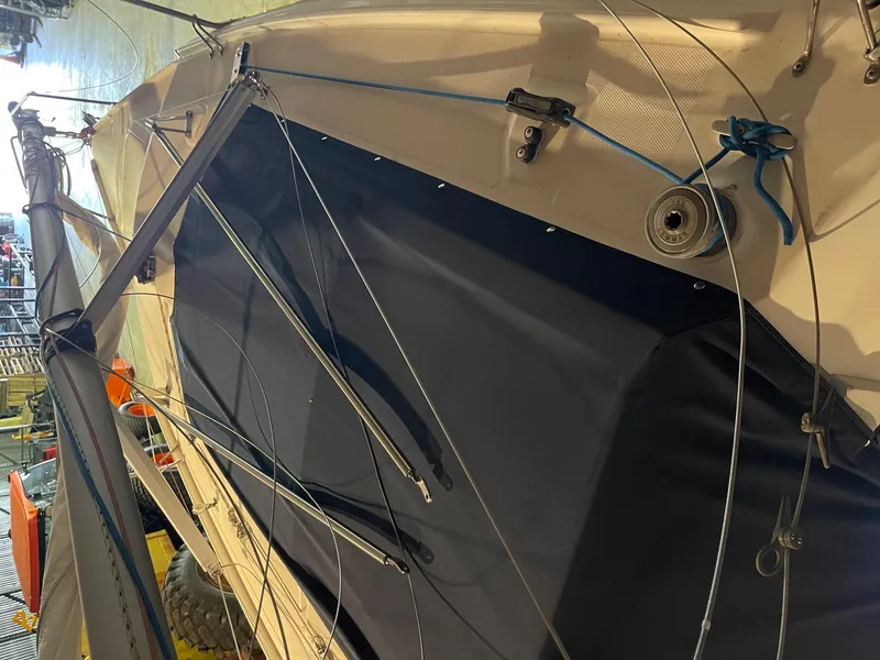 Slide: The Image of 2002 Hunter 260 sailboat with trailer, detailed rigging and mast view. - 37