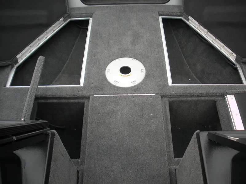 Slide: The Image of 2024 Smoker Craft Excursion Pro 176 DC Pro interior, featuring carpeted deck and storage compartments. - 3