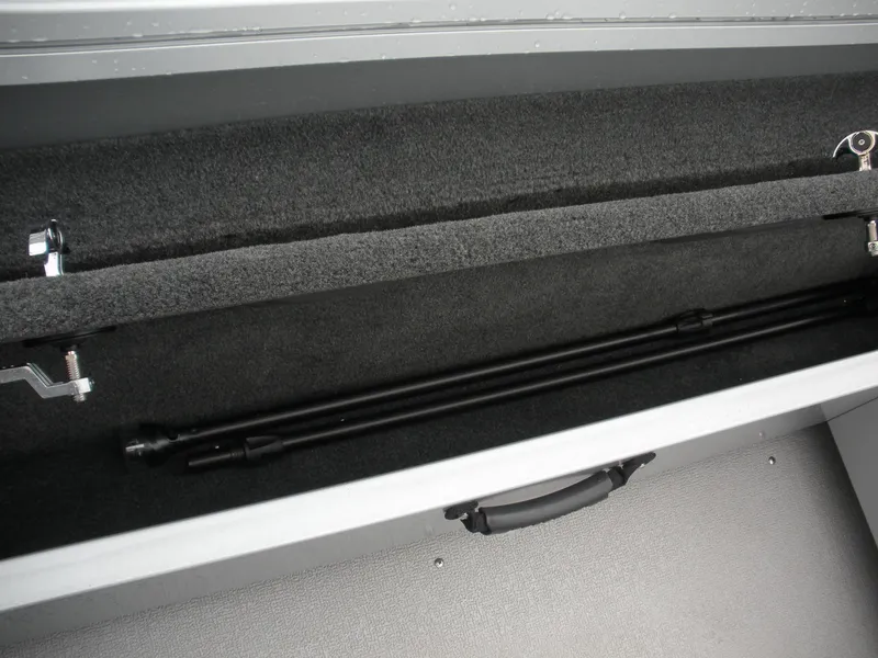 Slide: The Image of 2024 Smoker Craft Excursion Pro 176 DC Pro boat storage compartment with secure rod holders. - 9