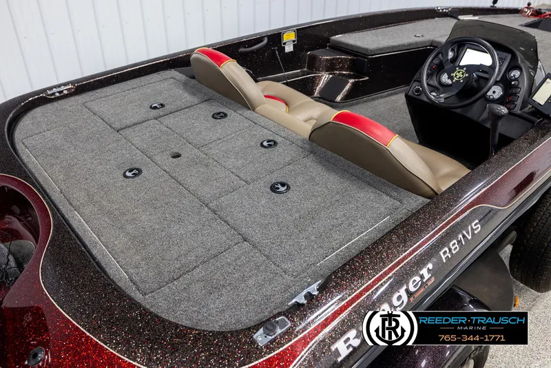 Slide: The Image of 2001 Ranger R81 boat interior with gray carpet and dual seats. - 10