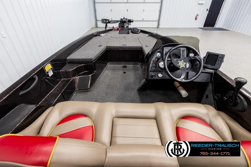 Slide: The Image of Interior of a 2001 Ranger R81 boat with steering wheel and seating. - 12