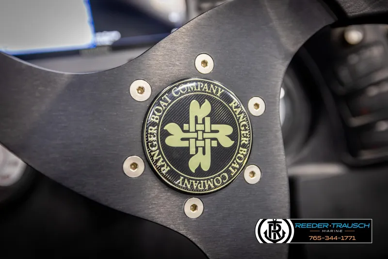 Slide: The Image of Steering wheel of 2001 Ranger R81 boat with Ranger Boat Company logo. - 27