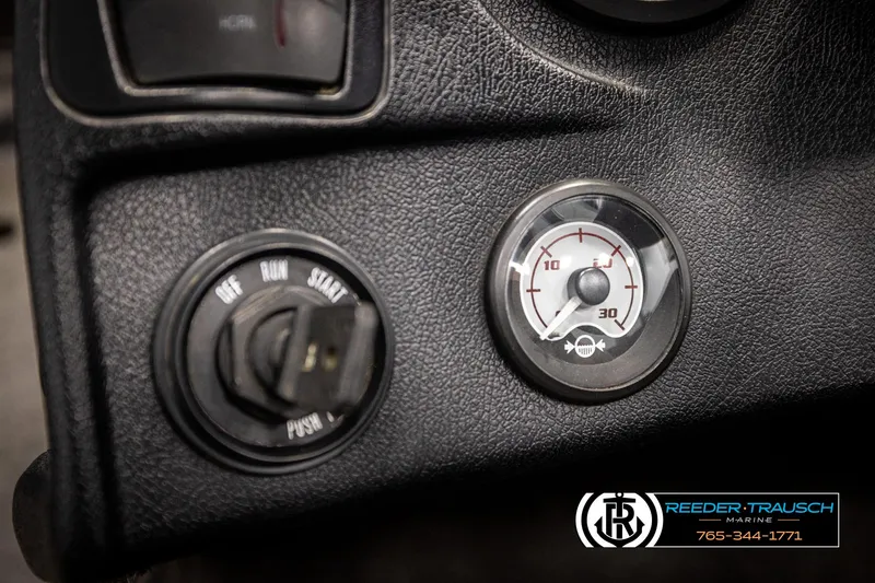 Slide: The Image of Dashboard of a 2001 Ranger R81 with ignition switch and gauge, featuring Reeder-Trausch branding. - 28