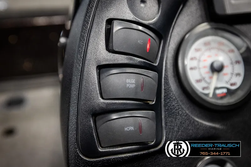 Slide: The Image of Control panel of a 2001 Ranger R81 boat with switches and gauge. - 29