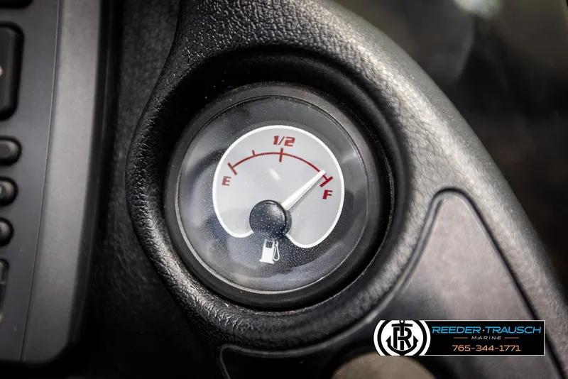 Slide: The Image of Fuel gauge of a 2001 Ranger R81 boat, showing near full. - 33