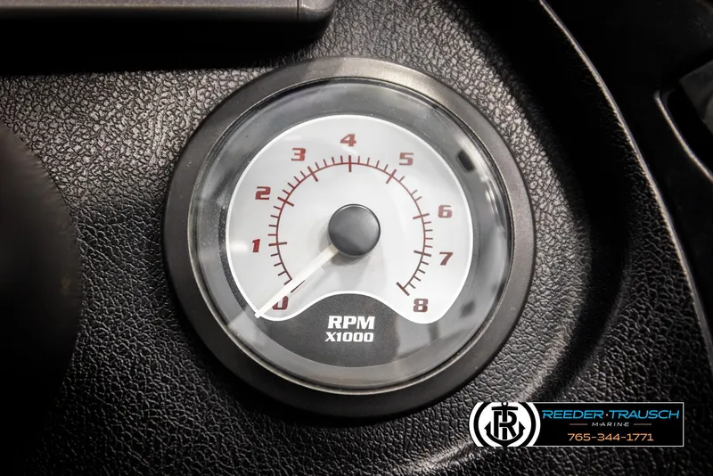 Slide: The Image of Tachometer of 2001 Ranger R81 boat, displaying RPM x1000, with Reeder-Trausch Marine logo. - 34