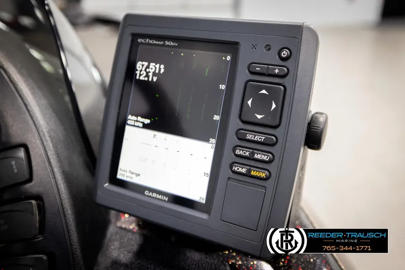 Slide: The Image of Garmin fishfinder display on 2001 Ranger R81 boat dashboard, showing depth and voltage readings. - 36