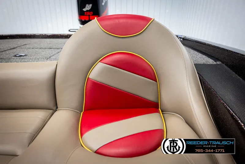 Slide: The Image of Red and beige boat seat in a 2001 Ranger R81, featuring yellow trim. - 38
