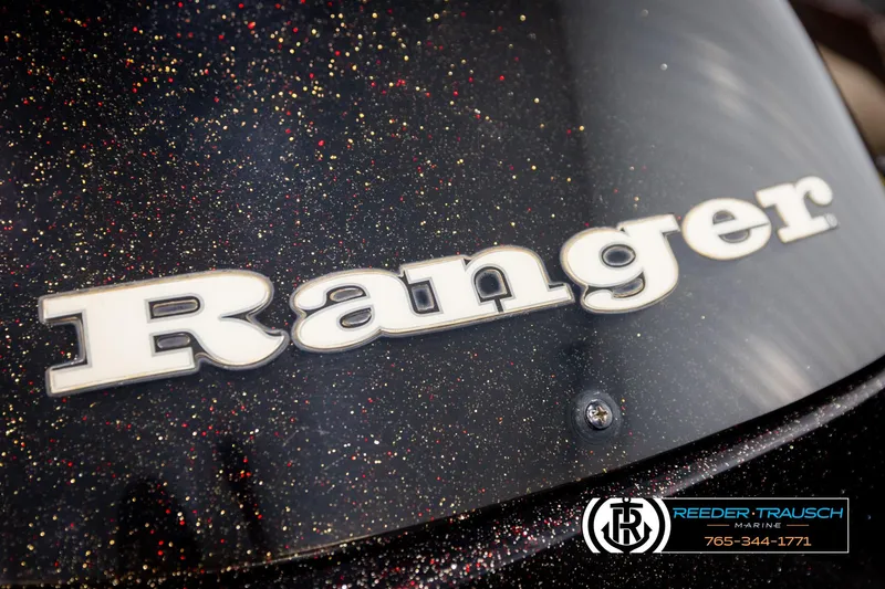 Slide: The Image of Ranger R81 2001 model logo on a glittery black surface, Reeder-Trausch Marine branding. - 39