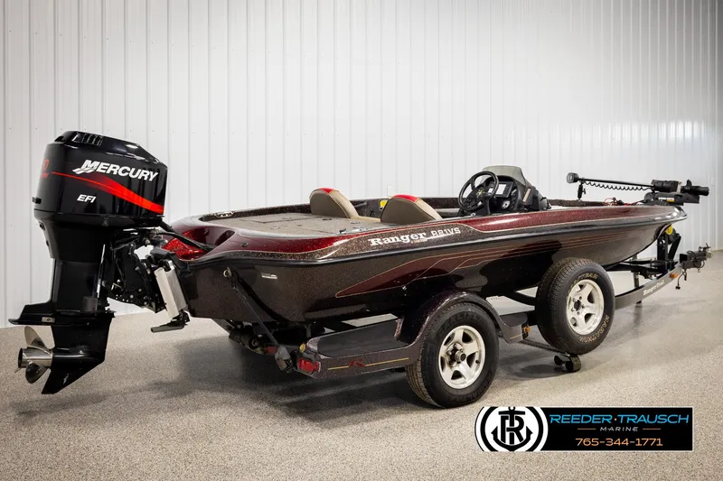 Slide: The Image of 2001 Ranger R81 boat with Mercury EFI engine on trailer in showroom. - 4