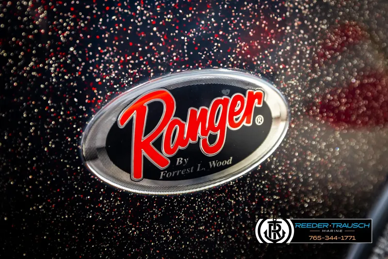 Slide: The Image of Close-up of 2001 Ranger R81 logo with red and black speckled background. - 40