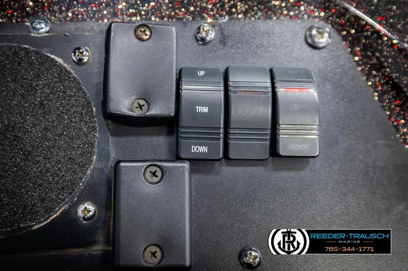 Slide: The Image of Control panel of a 2001 Ranger R81 boat with trim and lift switches. - 42