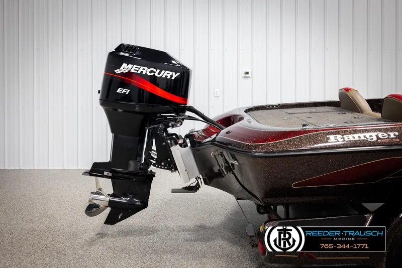 Slide: The Image of Ranger R81 boat with Mercury EFI engine, 2001 model, displayed indoors. - 46