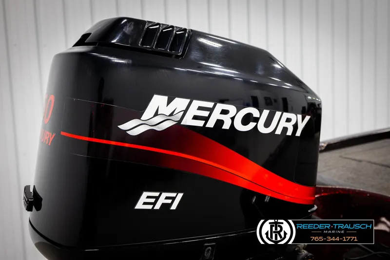 Slide: The Image of Mercury EFI outboard motor on a 2001 Ranger R81 boat, black with red accents. - 47