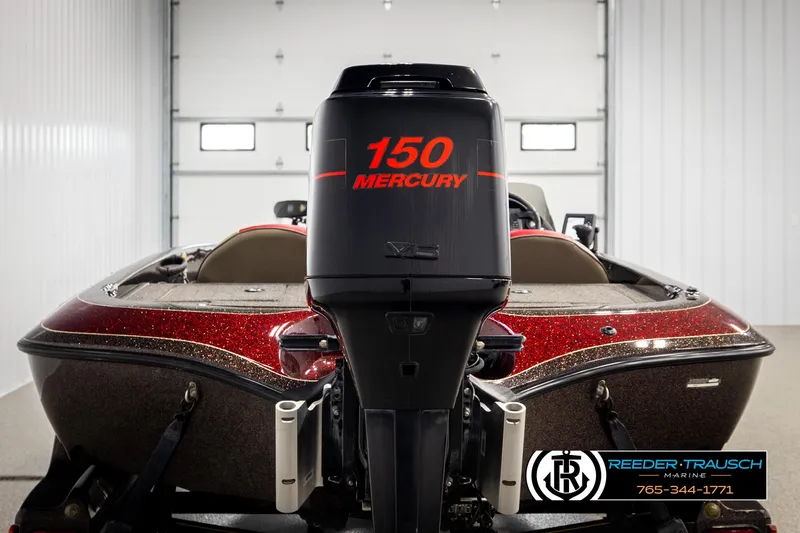 Slide: The Image of 2001 Ranger R81 boat with 150 Mercury engine in a garage setting. - 5