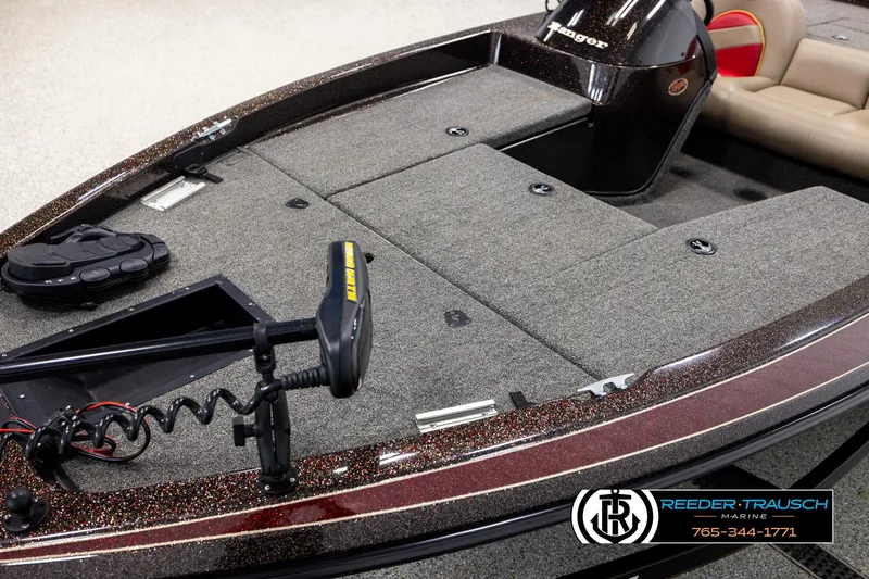 Slide: The Image of 2001 Ranger R81 boat deck with trolling motor and seating, Reeder Trausch branding visible. - 8