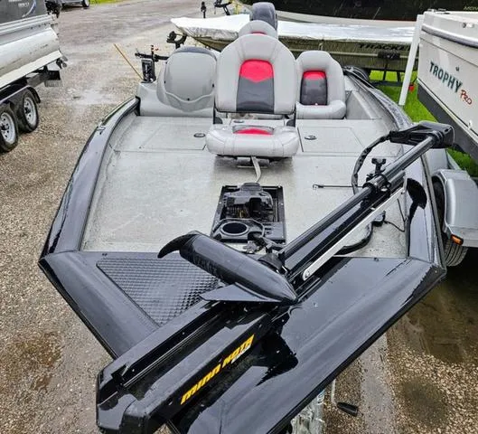 Slide: The Image of 2016 Tracker Pro Team™ 175 TXW boat on trailer, parked outdoors. - 3
