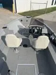 Slide: The Image of 2024 Smoker Craft Freedom 180 SC boat interior with dual seats and steering console. - 4